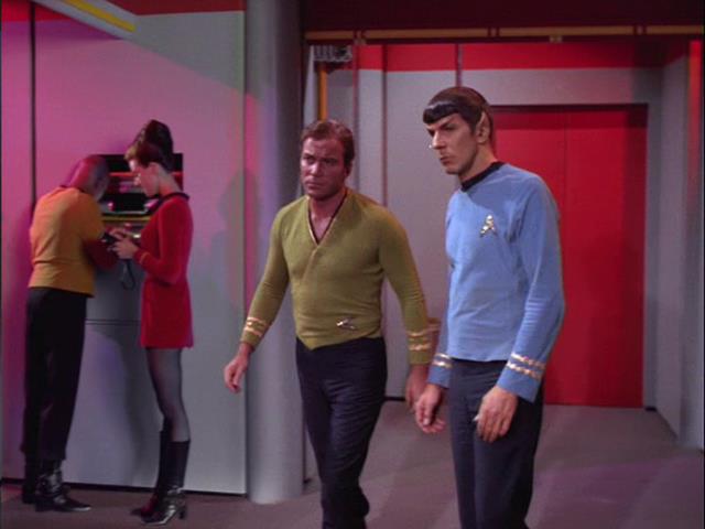 Sisko and Dax act casual as Kirk and Spock walk past
